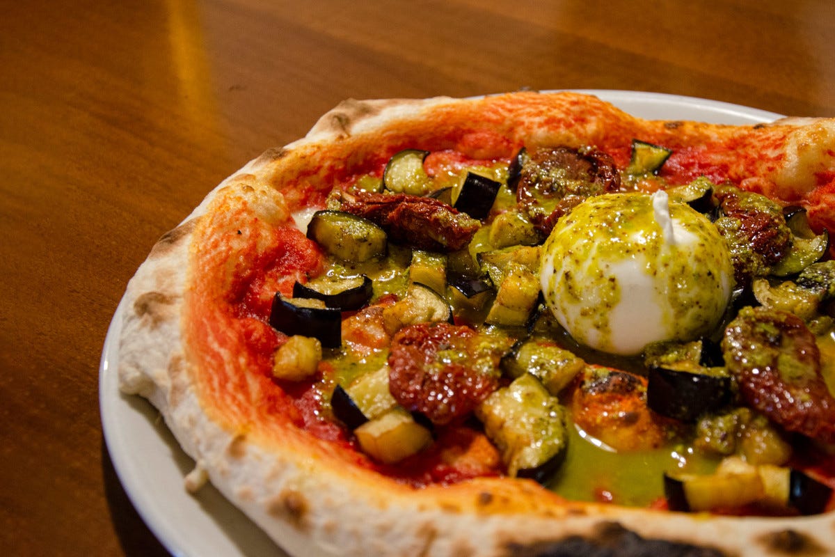 Un indirizzo per magiare una pizza gourmet a Bologna? Il Portico di San Donato