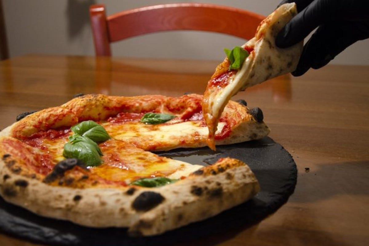 Un indirizzo per magiare una pizza gourmet a Bologna? Il Portico di San Donato